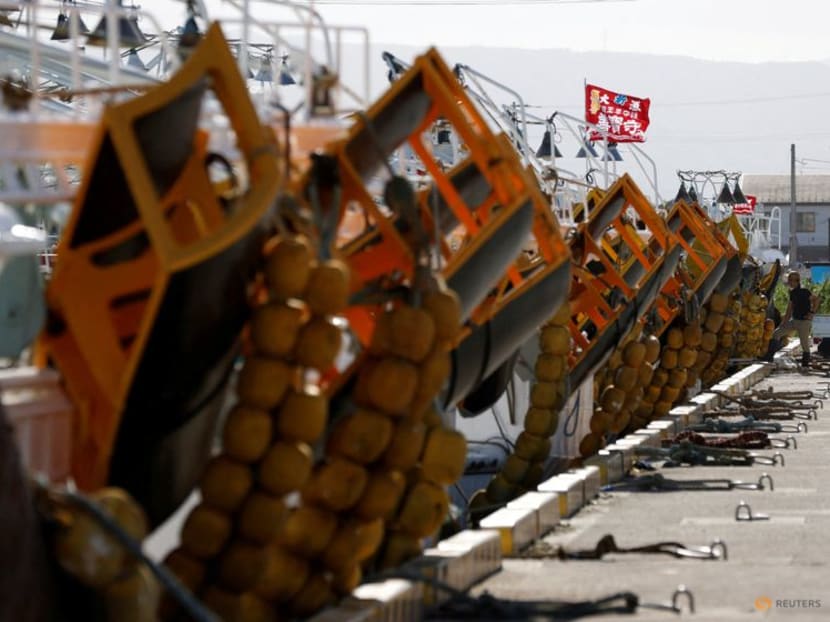 A fisherman stands next to fishing boats anchored at a fishing port in Soma, about 45km away from the tsunami-crippled Fukushima Daiichi nuclear plant discharging treated radioactive water into the ocean, Fukushima Prefecture, Japan, on Aug 31, 2023.