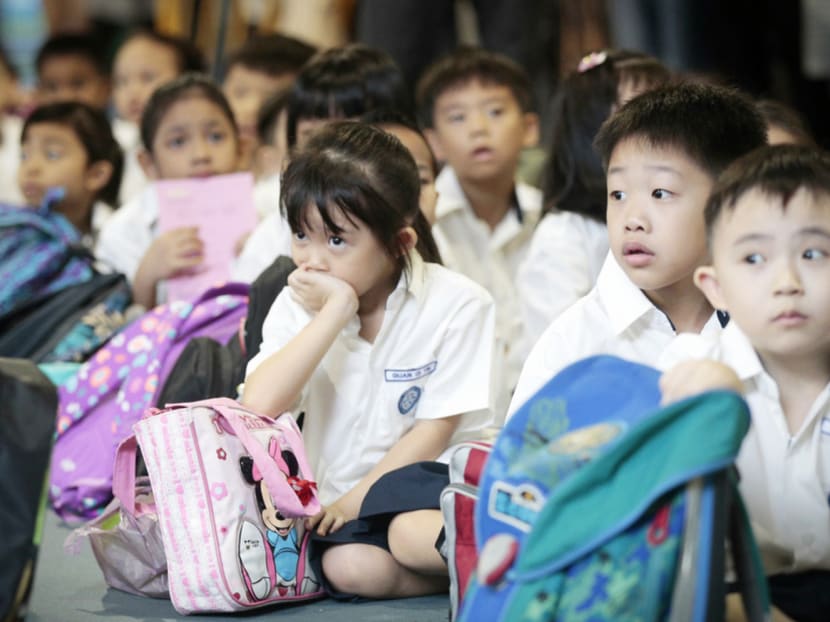 A typical school day starts early. It is still dark when children wake up to get ready to catch the school bus. Photo: Jason Quah