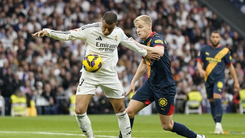 Real beat Girona 2-0 to move level on points with leaders Barcelona