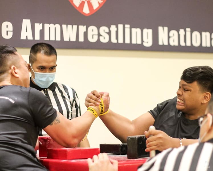Flexing muscles to grow the sport: Singapore’s arm wrestlers face off at first national championships