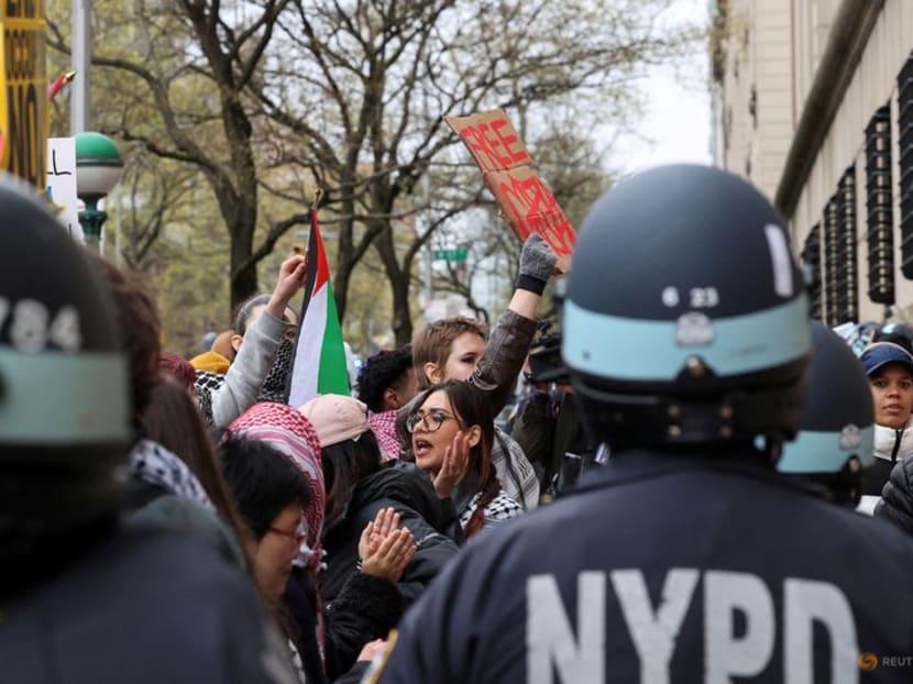 Law enforcement officers stand guard as demonstrators protest in solidarity with Pro-Palestinian organizers on the Columbia University campus, amid the ongoing conflict between Israel and the Palestinian Islamist group Hamas, in New York City, US, on April 18, 2024. 