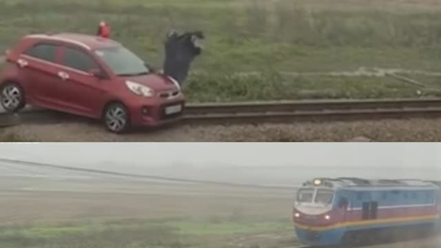 险酿大祸！越南女司机硬闯铁轨车被卡 货运火车百米前急停