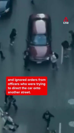 Car speeds through crowd of anti-ICE protestors in Chicago