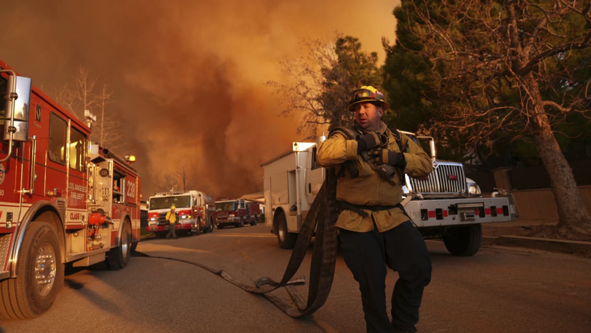 Big Los Angeles wildfire switches direction, posing new threat despite winds easing