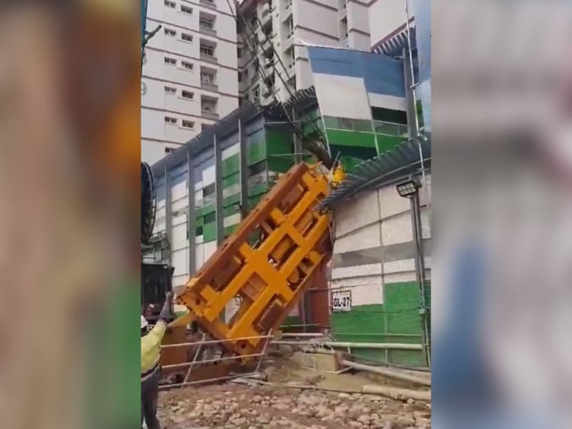 A screengrab of a video showing the moment a grabber collapsed at an MRT construction site in Pasir Ris. A screengrab of a video showing the moment a grabber collapsed at an MRT construction site in Pasir Ris.