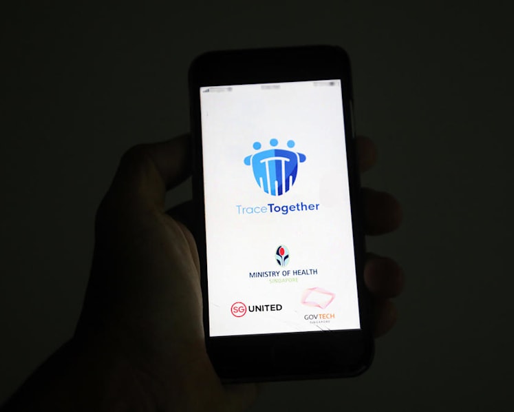 Compulsory to use TraceTogether to check in at venues such as malls, schools, workplaces by December: Govt