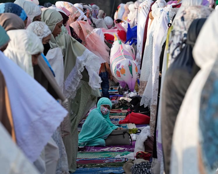 Muslims mark Eid al-Fitr holiday with joy, worry