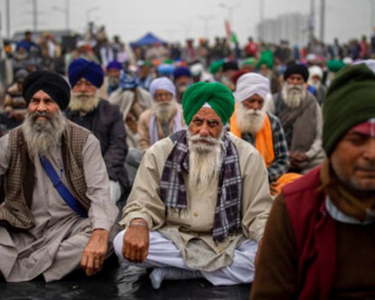 India's top court suspends implementation of new farm laws