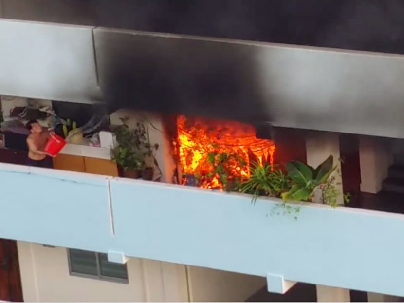 The fire at Blk 18 Eunos Cresent was put out by members of the public. Photo: Kenn Chin