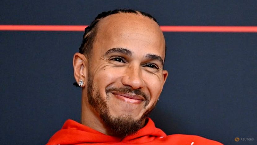 Hamilton sheds tear over Arsenal title as drivers swap lap times for football talk