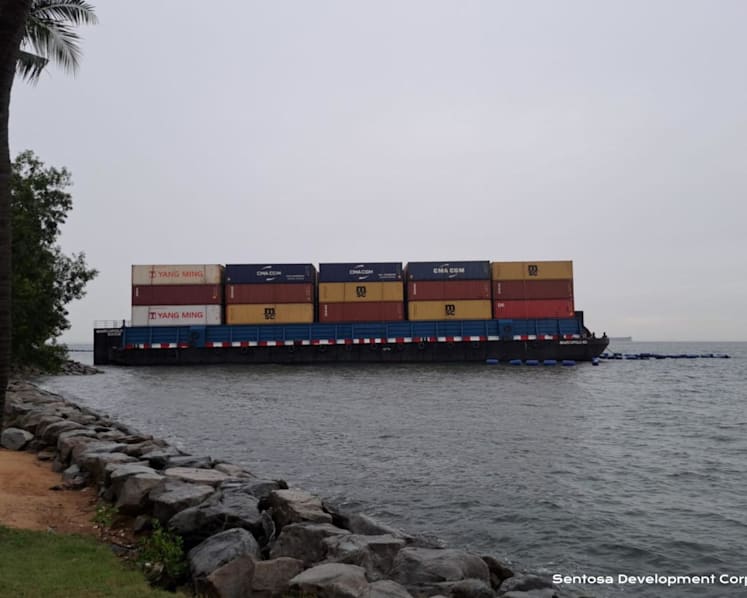 Barge that ran aground off Sentosa's Tanjong Beach safely towed away; floating barriers damaged