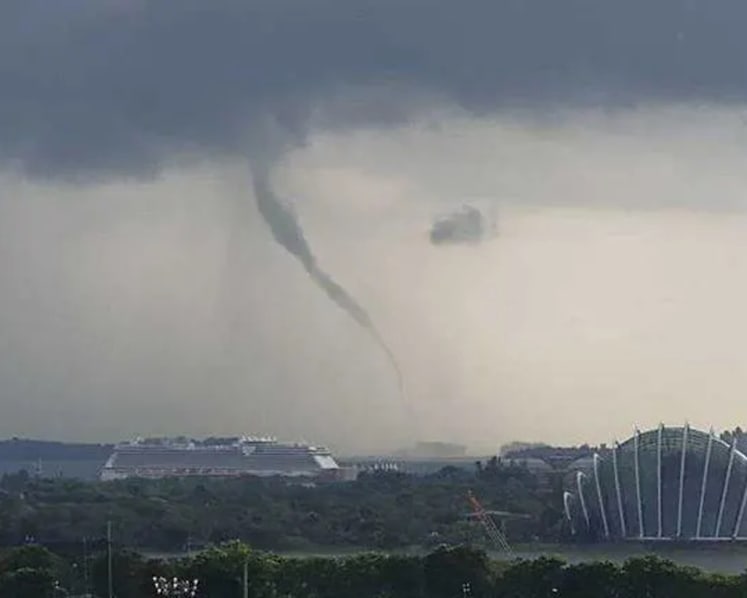 Waterspout seen off southern Singapore amid rainy, stormy weather