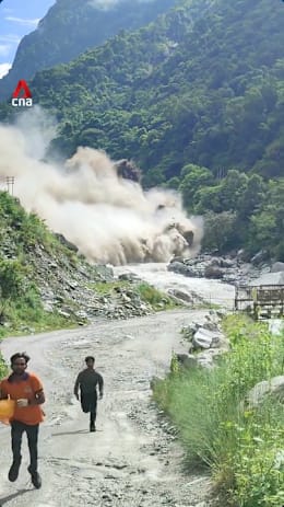 Workers seen fleeing from floodwaters in Nepal