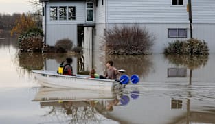 Immediate evacuations ordered for 3 Seattle suburbs after a levee failed from a week of heavy rain