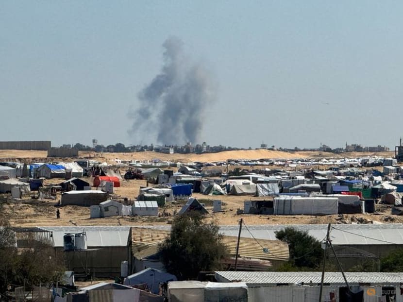 Smoke rises during an Israeli ground operation in Khan Younis, amid the ongoing conflict between Israel and the Palestinian Islamist group Hamas, as seen from a tent camp sheltering displaced Palestinians in Rafah, in the southern Gaza Strip on March 11, 2024.