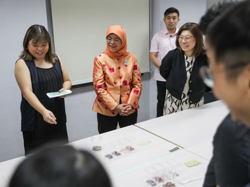 President Halimah Yacob (second from left) visiting social service agency Singapore Children's Society, to see how it works with its youth beneficiaries.