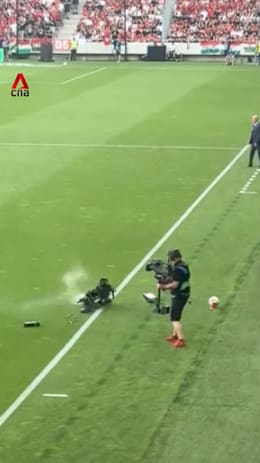 Cameraman narrowly avoids falling TV camera during Hungary-Kazakhstan match