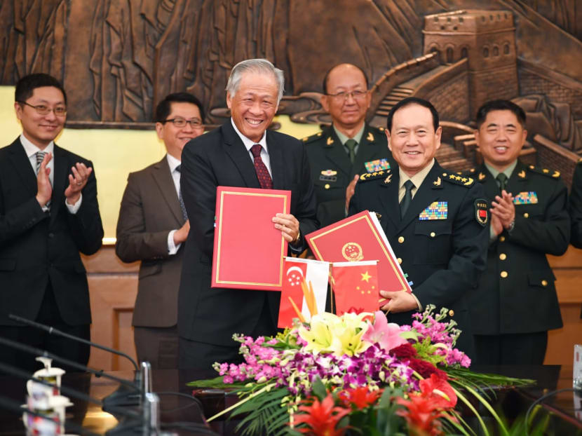 Singapore's Defence Minister Ng Eng Hen and his Chinese counterpart General Wei Fenghe at the signing of the updated defence agreement. Singapore's Defence Minister Ng Eng Hen and his Chinese counterpart General Wei Fenghe at the signing of the updated defence agreement.
