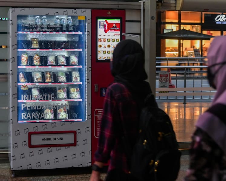 In Malaysia, trading using vending machines a way for lower income group to avoid handouts 