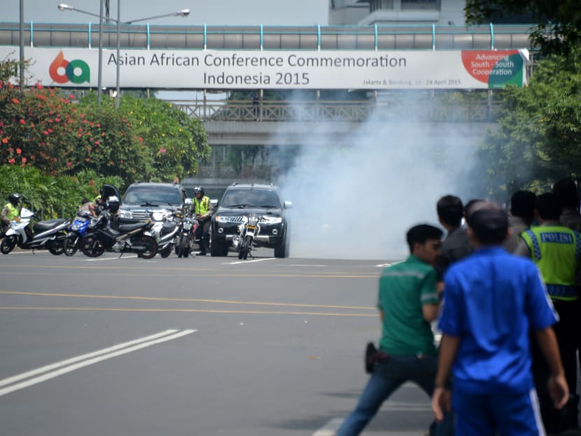 Seven dead in Jakarta blasts, gunfight