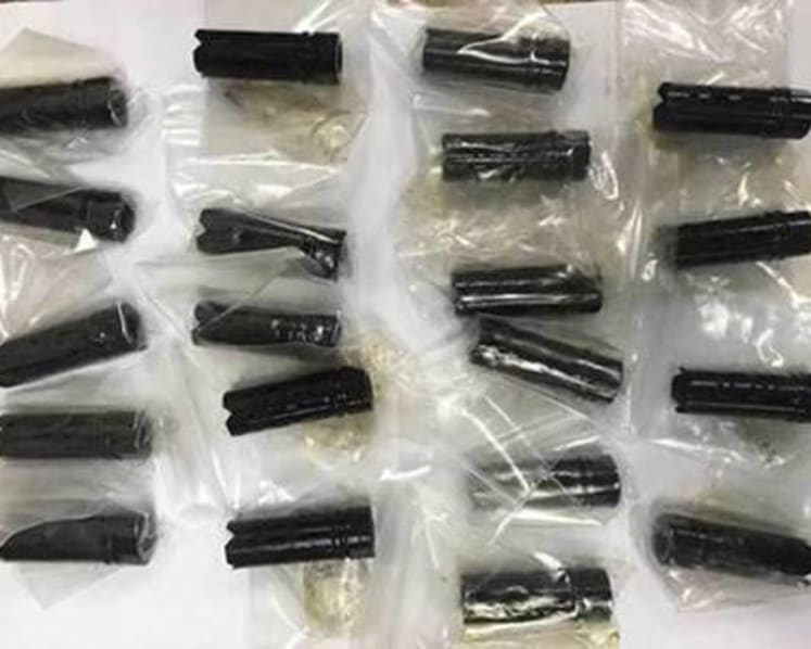 Police investigating 20 suspected gun parts found in postal parcel on transshipment