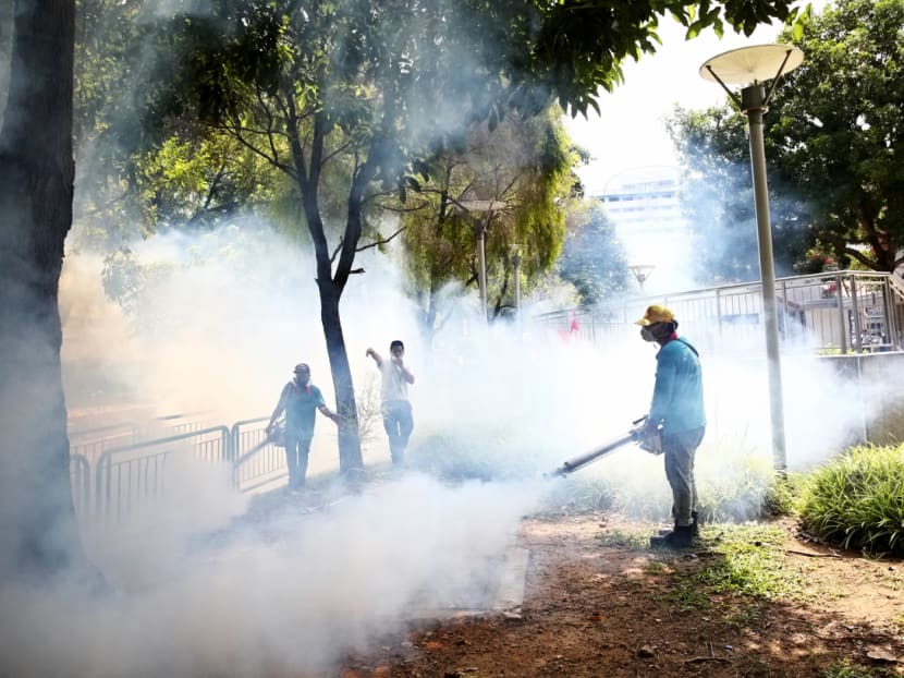 Pest control workers fogging around the Sims Drive area, Aug 29, 2016. Photo: Nuria Ling