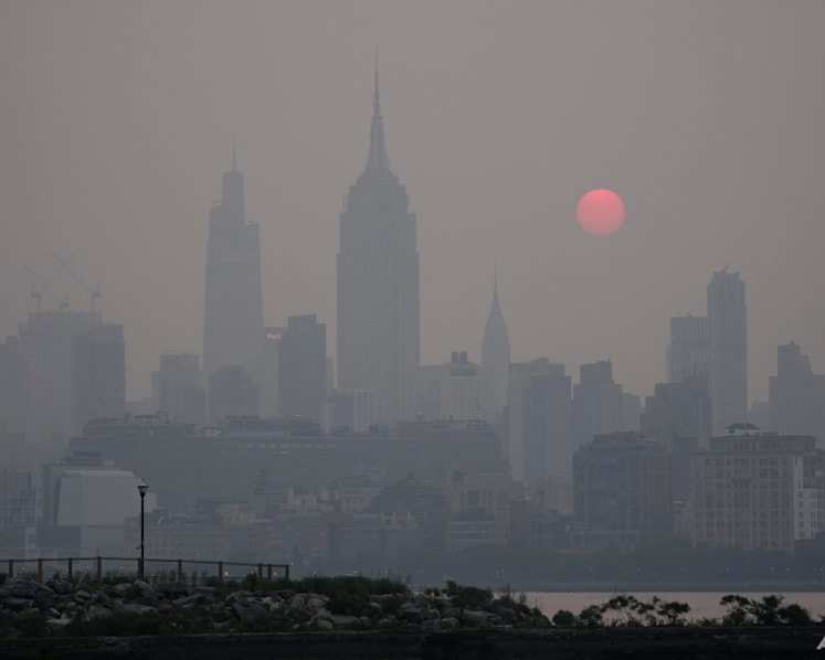 From NYC's skyline to Washington DC's monuments, wildfire haze envelopes familiar sites