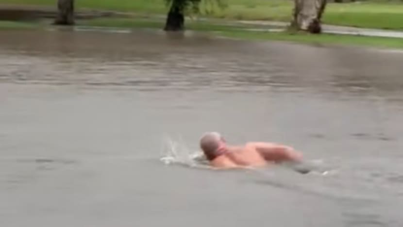 Man swims at flooded golf course as heavy rainfall, flash flooding hit Sydney