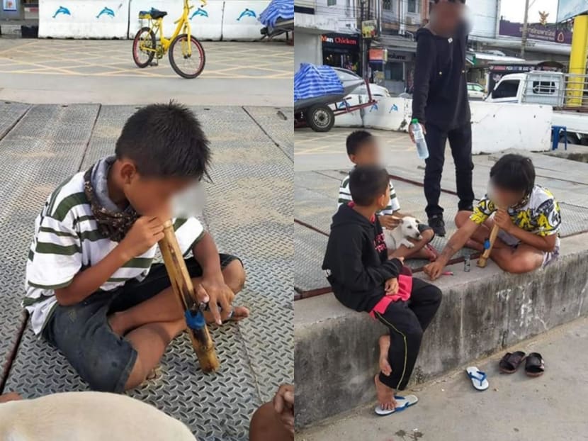 Two young boys were spotted sharing a bamboo bong and smoking marijuana openly along Pattaya beach in Chon Buri province, Thailand. Two young boys were spotted sharing a bamboo bong and smoking marijuana openly along Pattaya beach in Chon Buri province, Thailand.
