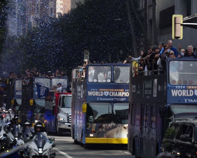 Baseball-Ohtani teases 'three-peat' as Dodgers parade draws Los Angeles crowds