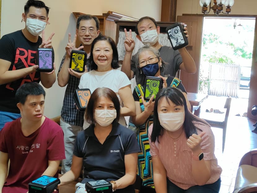 Volunteers from The Sound of Kindness during a music-making session with a family.