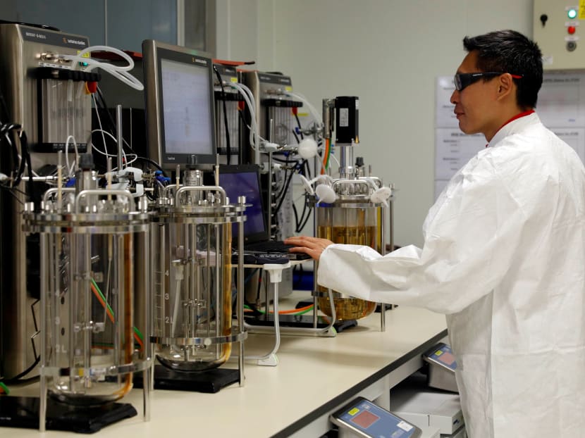 An employee checks readings at a laboratory in a pharmaceutical manufacturing factory in Singapore, April 17, 2017.