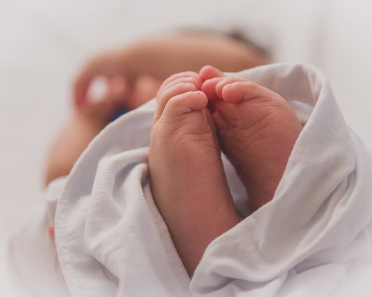Baby likely suffocated to death after mother fell asleep breastfeeding him: Coroner