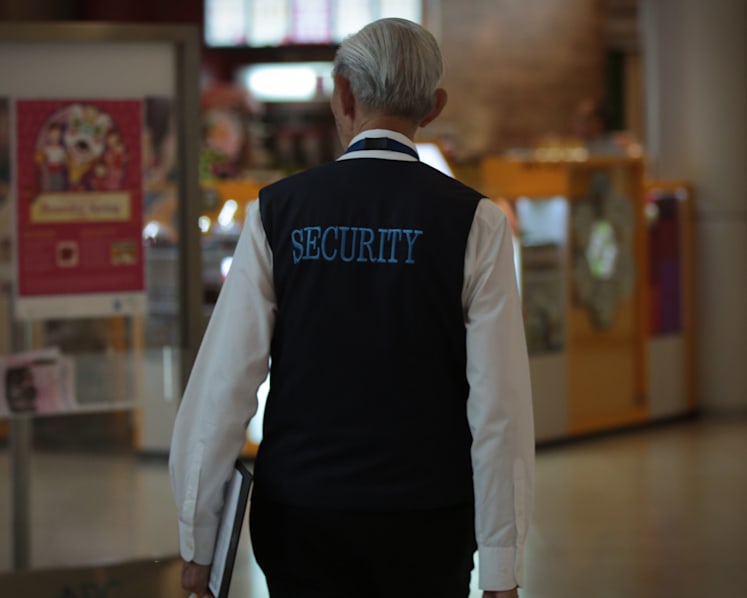 Police reviewing contentious bell-curve grading system for security firms