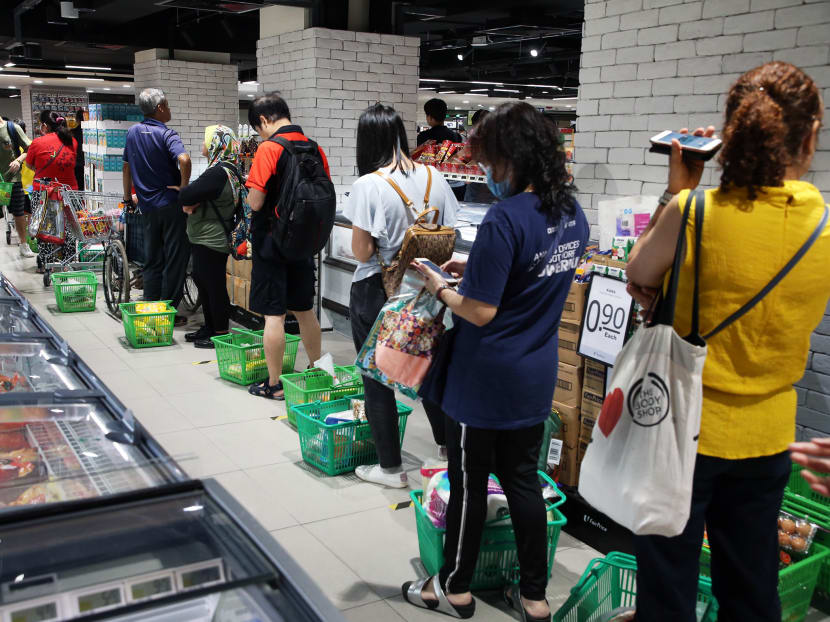A queue at the NTUC FairPrice outlet in Woodlands Civic Centre at about 6.30pm on April 3, 2020.