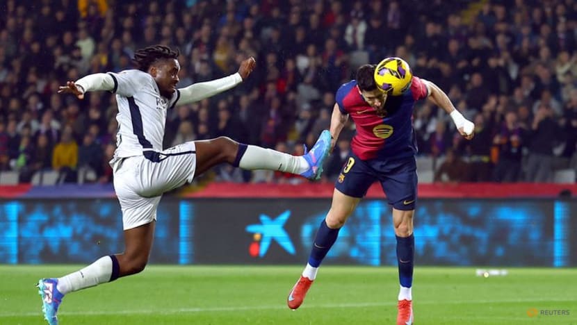 Barcelona ease past Osasuna to go three points clear