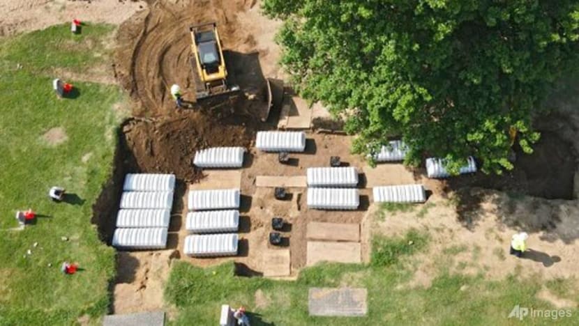 19 bodies reburied amid protests in search for tvictims