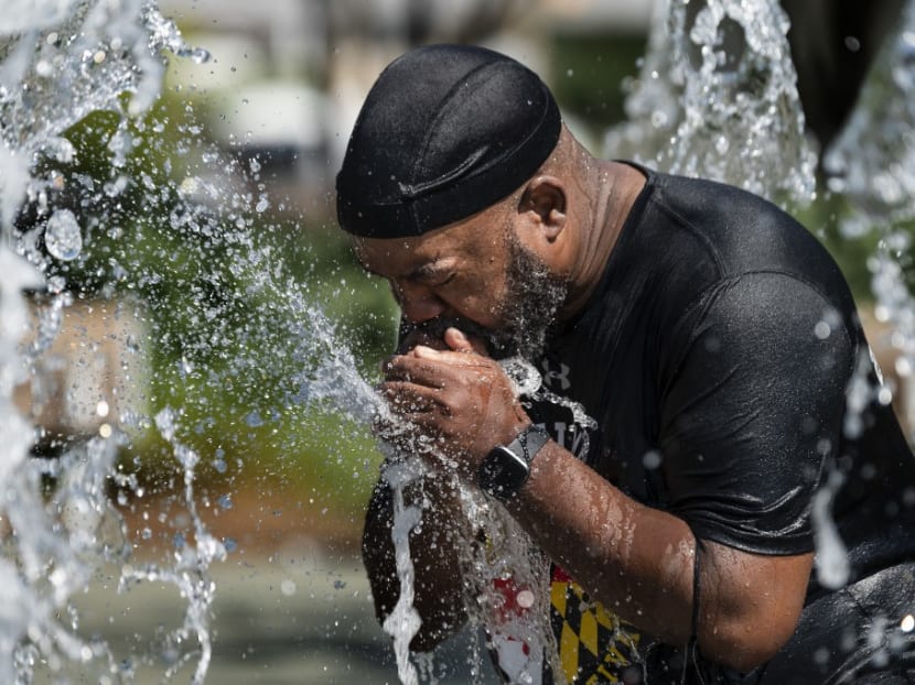 A man cools off in a fountain at Inner Harbor in Baltimore, Maryland, on June 30, 2021, as a heat wave threatens to make it Baltimore’s hottest day of the year. A man cools off in a fountain at Inner Harbor in Baltimore, Maryland, on June 30, 2021, as a heat wave threatens to make it Baltimore’s hottest day of the year.