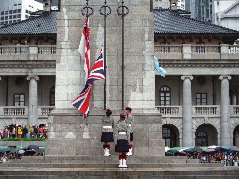 File photo of British soldiers lowering the Union Jack flag in the central district of Hong Kong just hours prior to the end of some 156 years of British colonial rule on June 30, 1997. Nearly 20 years after Hong Kong was returned to China, the British army is back. Photo: AFP
