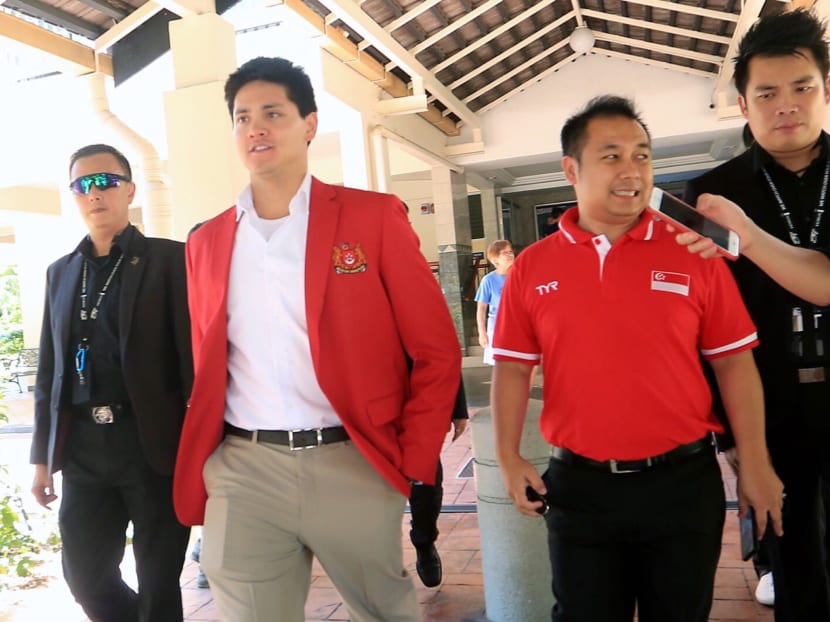 Olympic champion Joseph Schooling (second from left) with Mohamed Hafidz Ja’afar (second from right), the former manager of Swim Schooling.