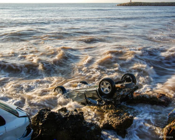 Floods sweep cars into sea, damage homes in northeast Spain