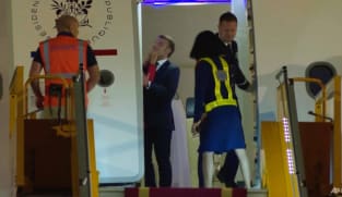 Macron plays down apparent shove from wife in Vietnam