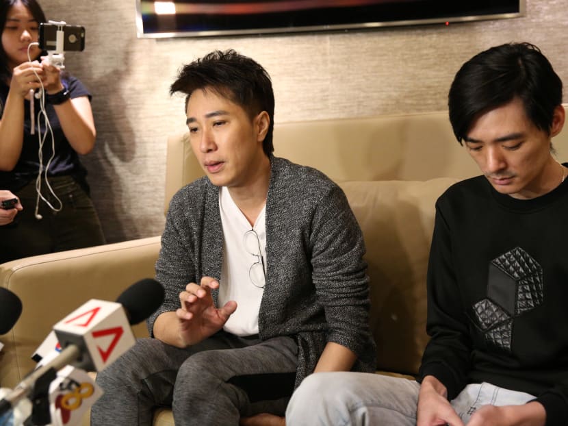 Mr Dasmond Koh (left), mentor to the late actor Aloysius Pang, and Pang's older brother Kenny speaking to the media at Changi Airport.