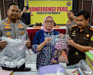 Indonesian police charge 13 in daycare abuse scandal