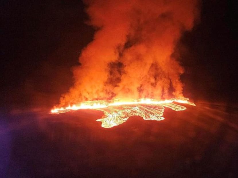 A volcano spews lava and smoke as it erupts in Reykjanes Peninsula, Iceland, on Jan 14, 2024. 