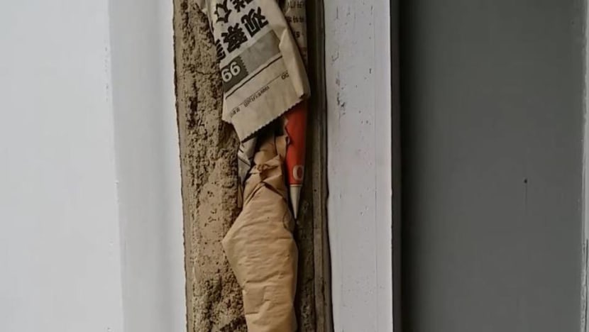 HDB investigating after newspaper found stuffed within walls of flat HDB investigating after newspaper found stuffed within walls of flat
