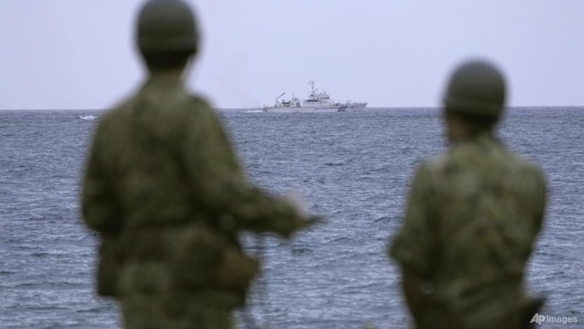 Debris found in search for missing Japanese army helicopter with 10 crew on board 