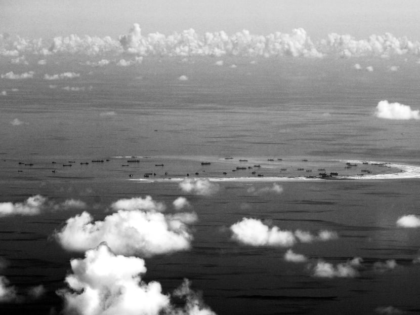 Dozens of Chinese dredgers, bulldozers and construction-related vessels have turned reefs into reclaimed land as China secures a stronger footing in the strategic waterways. Photo: Reuters Dozens of Chinese dredgers, bulldozers and construction-related vessels have turned reefs into reclaimed land as China secures a stronger footing in the strategic waterways. Photo: Reuters
