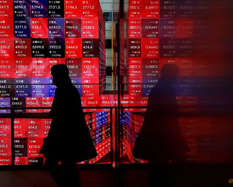 Japan's Nikkei ends at record high as automakers rise on weaker yen