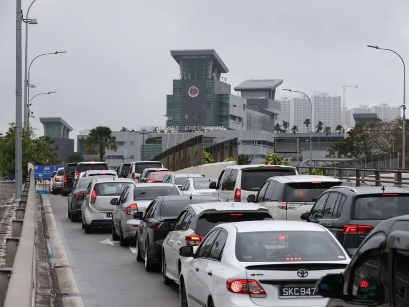 A file photo of a queue of cars heading towards Woodlands Checkpoint in January 2023. A file photo of a queue of cars heading towards Woodlands Checkpoint in January 2023.